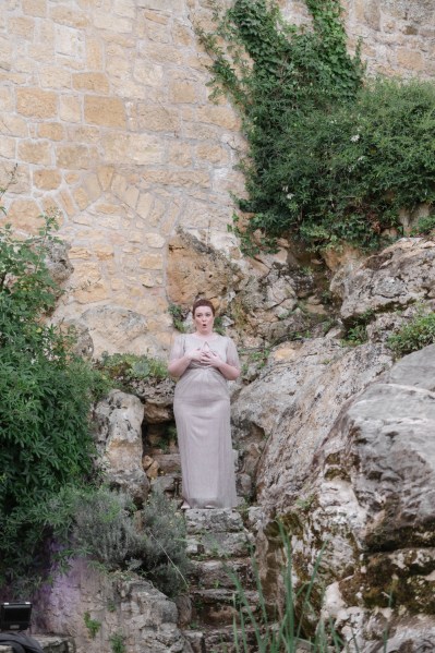 Joyous bridesmaids gestures to audience and guests