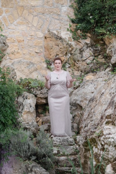 Joyous bridesmaids gestures to audience and guests