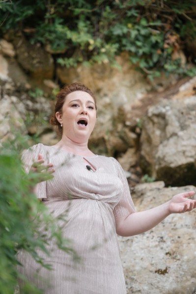 Joyous bridesmaids gestures to audience and guests