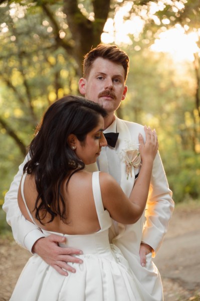 Bride and groom hold each other