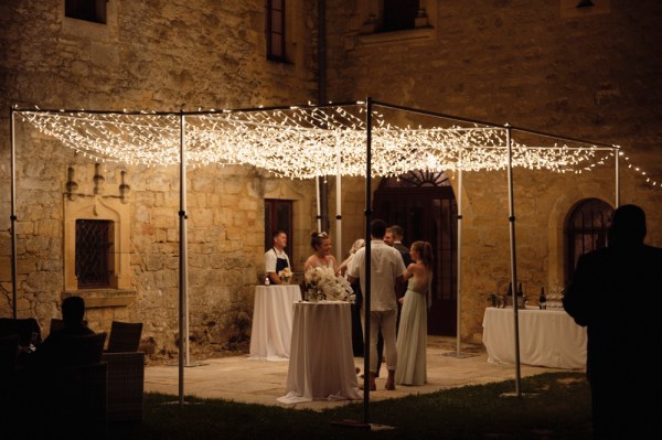 Lights above couple and guests