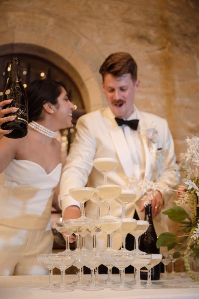 Bride and groom bowtie champagne fountain and glasses