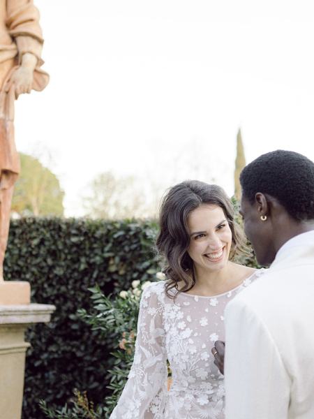 Bride looks at groom laughing smiling