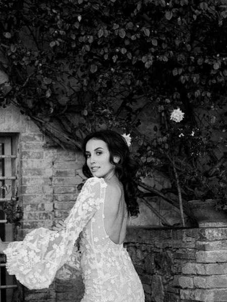 Black and white bride from behind in lace gown