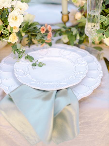 Orange flowers table serviette cutlery on table