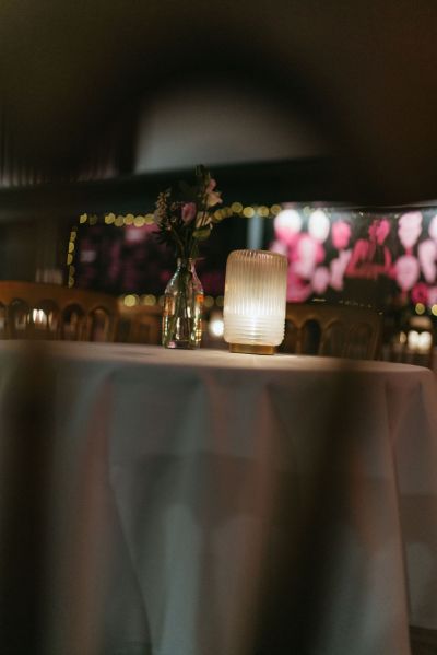 Cinema setting lights candles on table