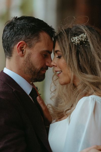 Close shot of groom facing his bride