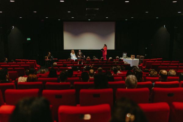 Cinema ceremony room audience guests red seats