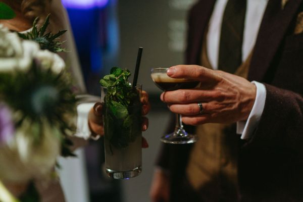 Guests cheers with cocktails espresso martini