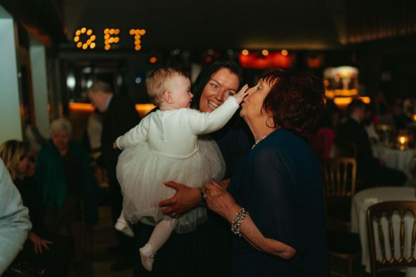 Little baby girl and grandmother play