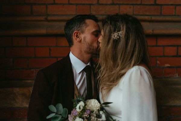 Bride and groom kiss