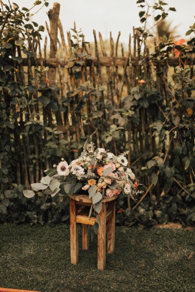 Close up of flowers bouquet resting on stool