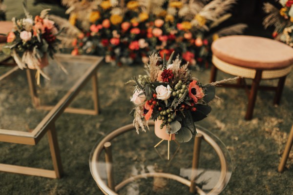 Flowers in vase resting on glass table