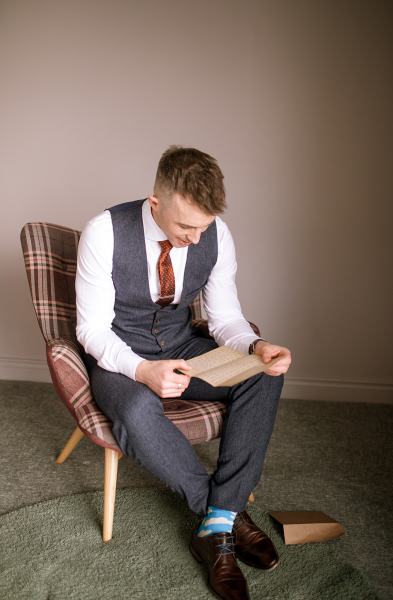 Groom opens gift from bride