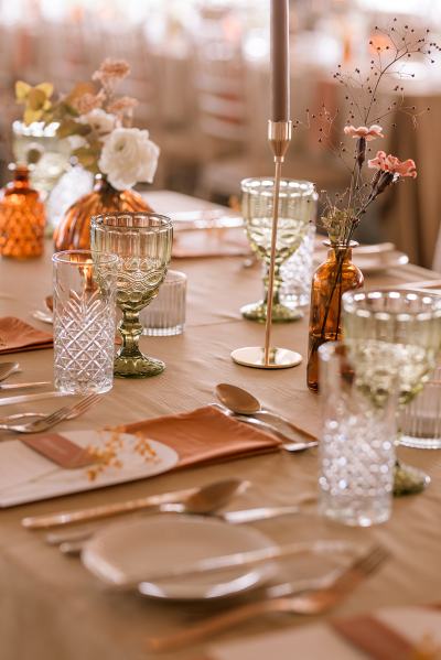 Empty dining room setting lights table and chairs candles lit for guests