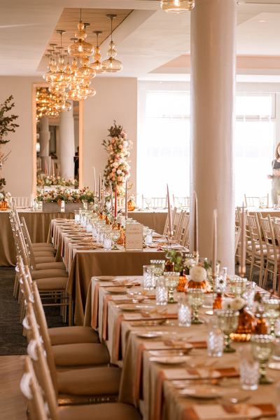 Empty dining room setting lights table and chairs candles lit for guests