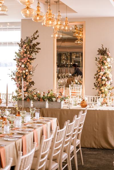 Empty dining room setting lights table and chairs candles lit for guests mirror