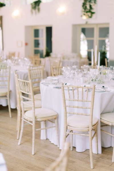 Empty table setting dining room candles lit cutlery