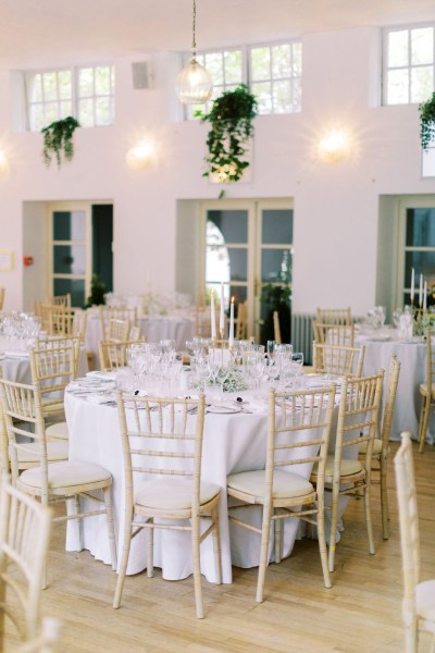 Empty table setting dining room candles lit cutlery