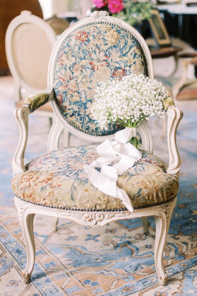 Flowers bouquet resting on chair