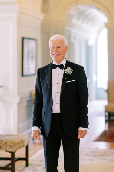 Father smiles at his daughter bride