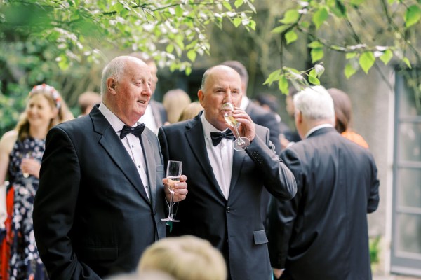 Men drinking glasses of prosecco