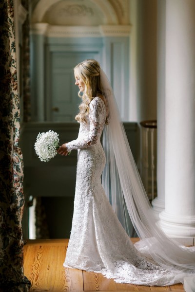 Bride holds bouquet in hand