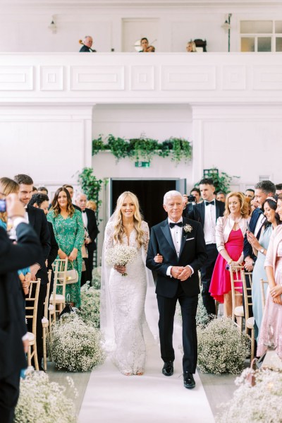 Father of the bride walks her down the aisle