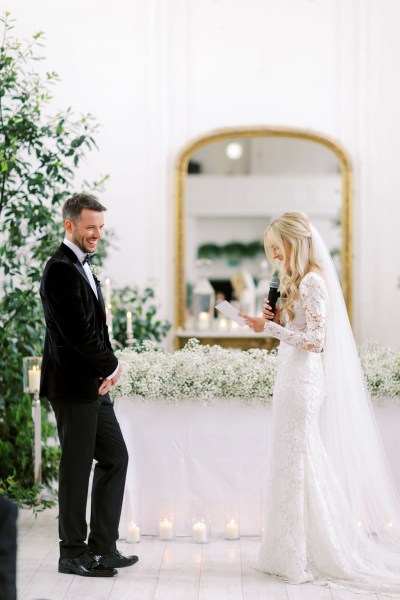 Bride reads out her vows to groom into microphone