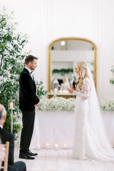 Bride reads out her vows to groom into microphone