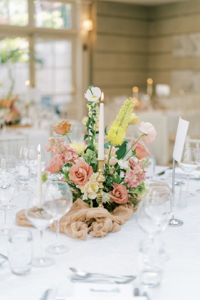 Roses cutlery on table candles lit