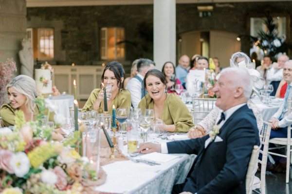 Father and bridesmaids at dining room table