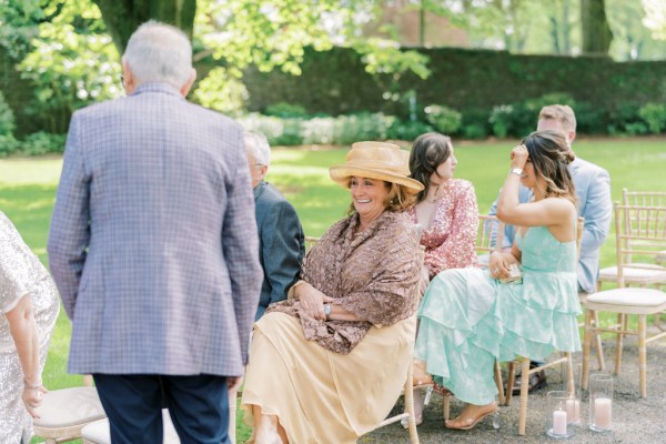 Guests awaiting the bride seated in seats during ceremony