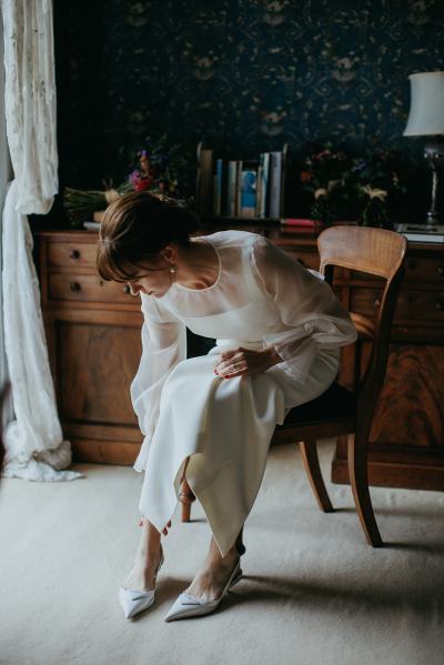 Bride puts on her bridal heels/shoes