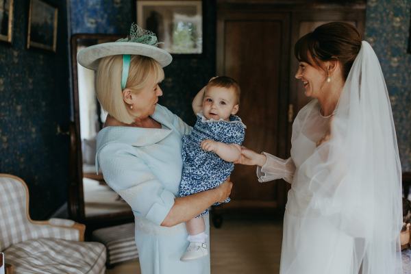 Mother little baby granddaughter and daughter bride