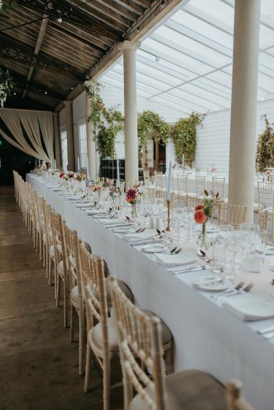 Empty dining room setting table and chairs cutlery