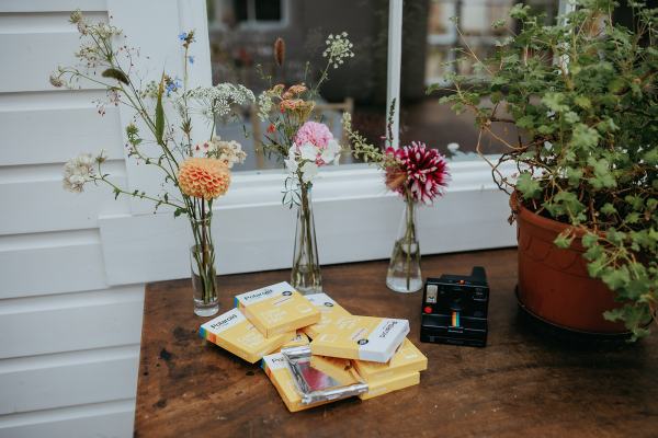 Flowers and crayons on table