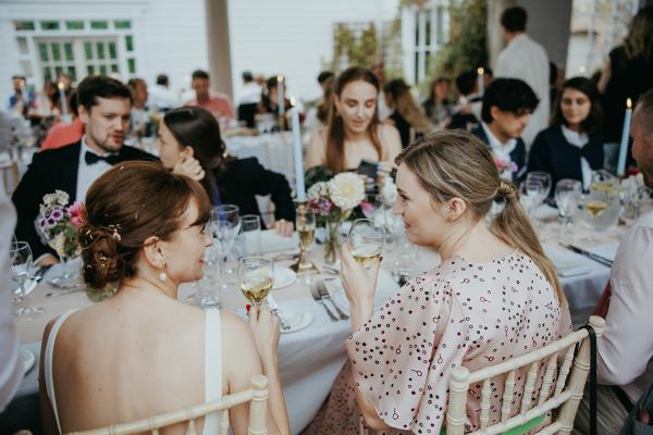 Bride and bridesmaids seated dining room