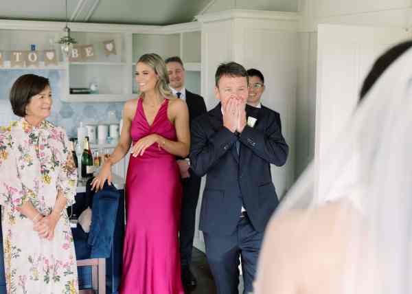 Father reacts to bride as he sees her in gown for the first time