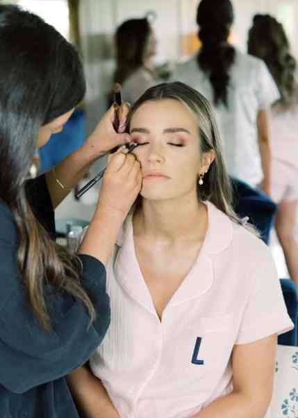 Bride gets her makeup done by MUA