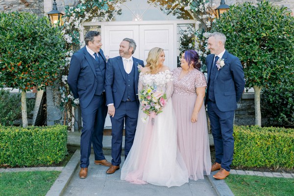 Family shot bride groom bridesmaids and groomsmen