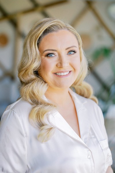 Brides wavy blonde hair detail she smiles