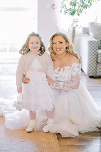 Bride and little girl daughter pose for the camera