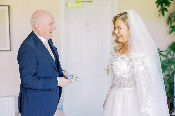 Father and daughter bride smiling laughing