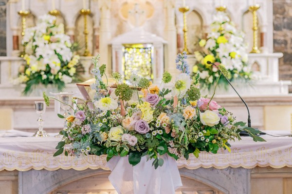 Flowers resting on church table at alter