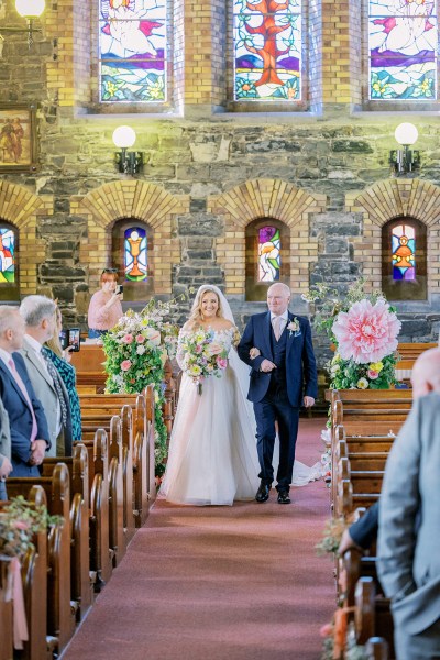 Father of the bride walks down the aisle