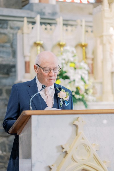 Father gives speech at alter podium