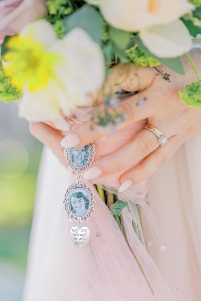 Close up of photo of mother necklace chain in memory of and hand detail ring