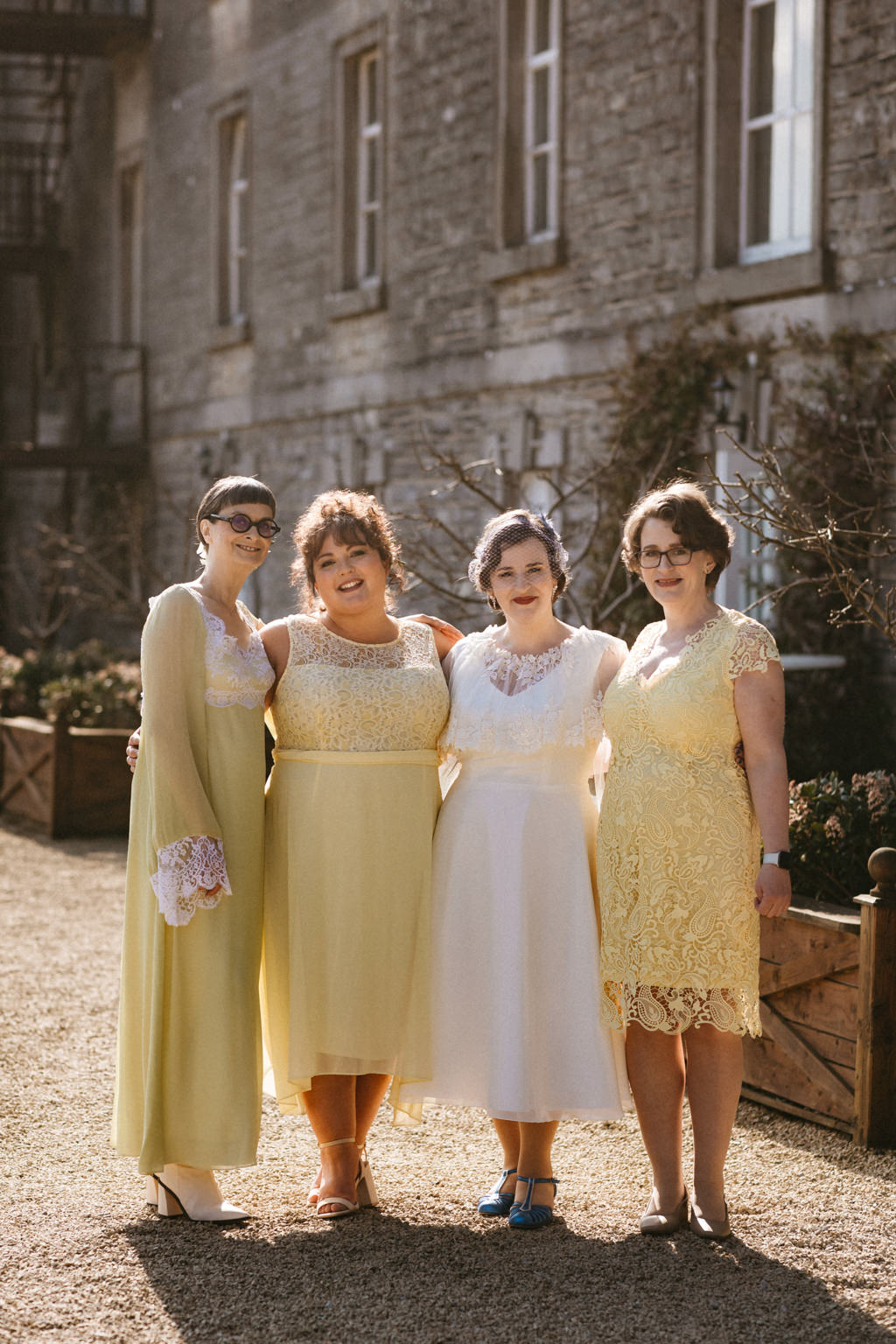 Bride and her bridesmaids in yellow dresses