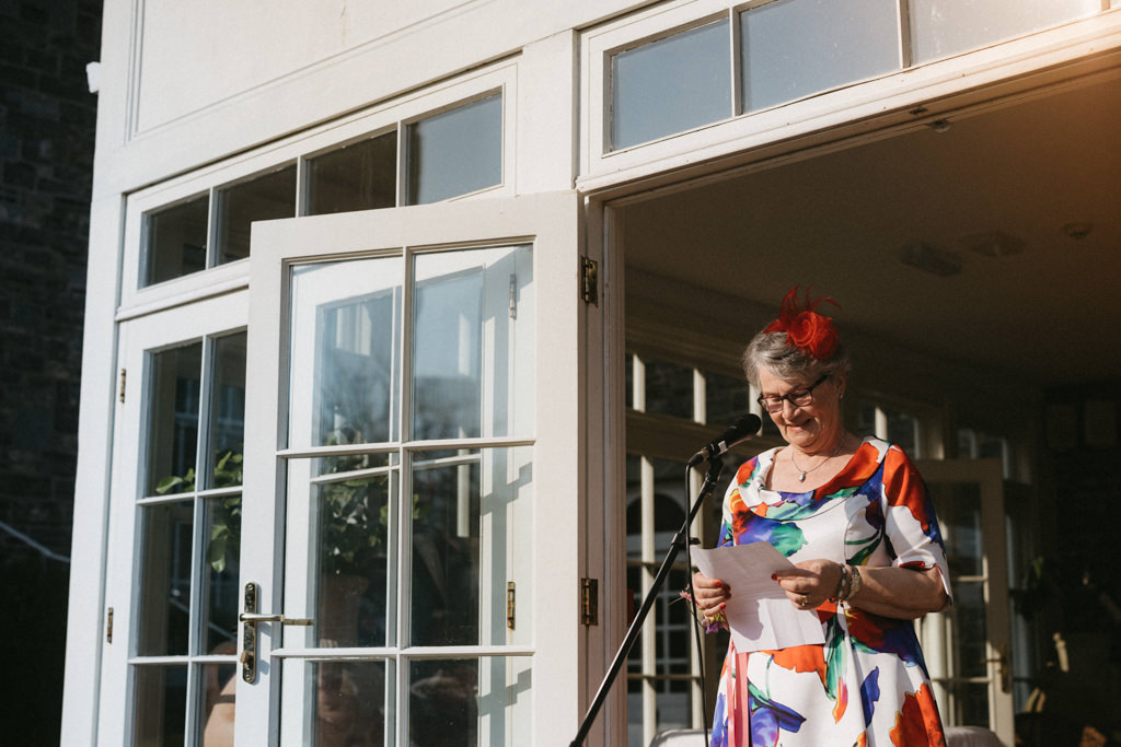 Celebrant speaks into microphone